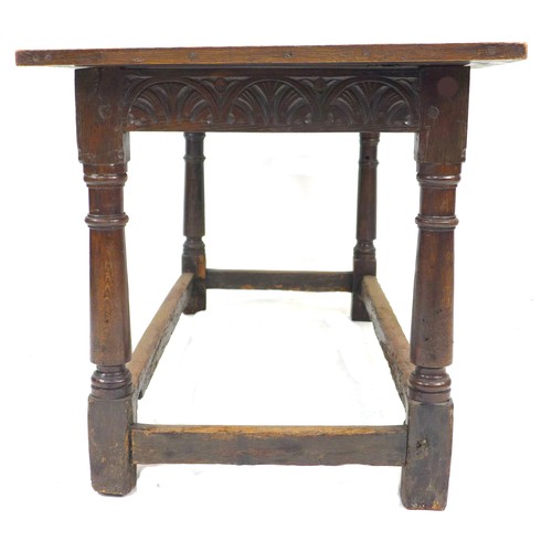 298 - A Tudor style stained oak dining table, possibly 18th century with later four plank top and bread bo... 