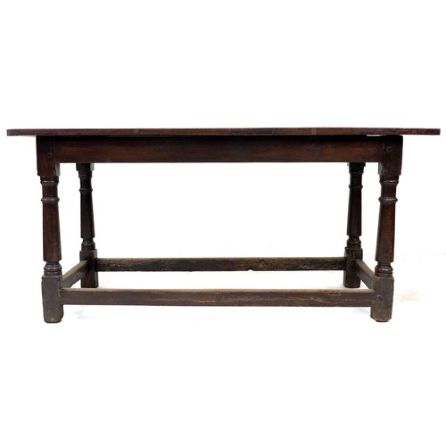 298 - A Tudor style stained oak dining table, possibly 18th century with later four plank top and bread bo... 