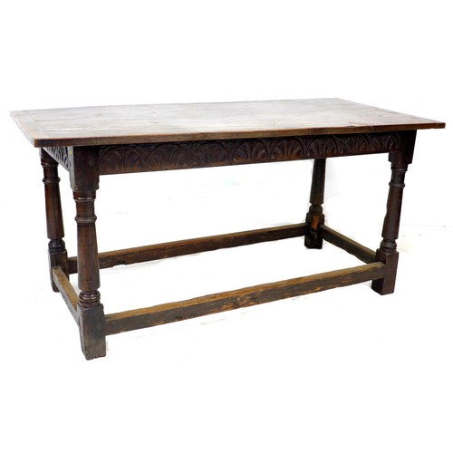 298 - A Tudor style stained oak dining table, possibly 18th century with later four plank top and bread bo... 