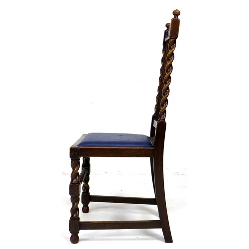 242 - A set of four Edwardian oak dining chairs, with carved crests to the rails, five splat back, and bar... 