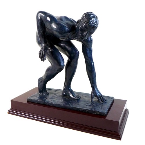 85 - Ian Rank-Broadley FRBS (British, b. 1952): 'Crouching Youth', a bronze figural sculpture, with dark ... 