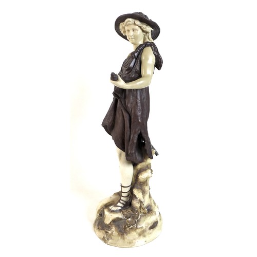 71 - A Rudolstadt ivory porcelain figure modelled as a male dressed in a bear skin and carrying a bird, o... 