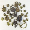 A collection of antique metal and brass padlocks, some with keys, including 'Champion 6-Lever', 5.7 ... 