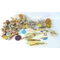 A collection of sewing and needlework items, including several bobbins, crocheting tools, reels of c... 