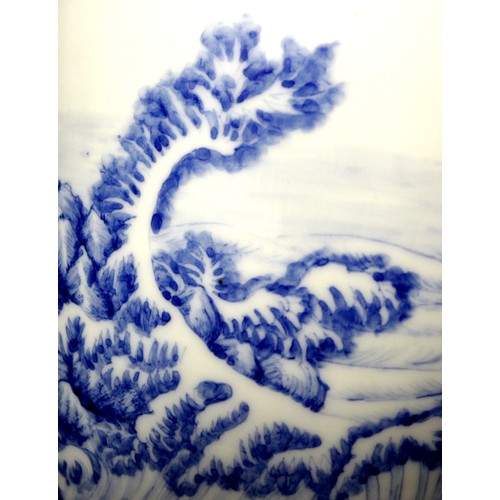 1 - A Japanese Meiji Period porcelain lantern vase, finely decorated in underglaze blue with nine cranes... 