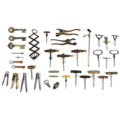 55 - An impressive collection of antique corkscrews, comprising a Victorian Lund single lever corkscrew, ... 