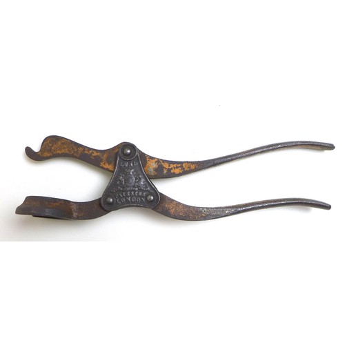 55 - An impressive collection of antique corkscrews, comprising a Victorian Lund single lever corkscrew, ... 