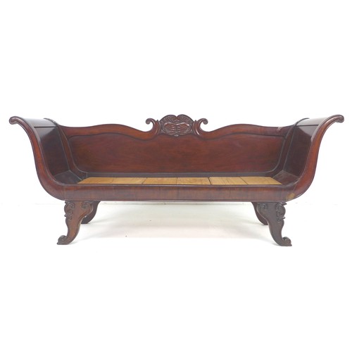 303 - An early 19th century hall seat, narrow form settee, with scroll arms, carved decoration, and solid ... 