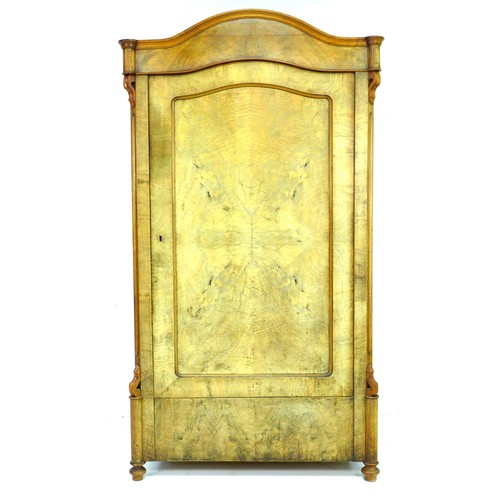 289 - A 19th century mahogany veneered wardrobe, single arched door enclosing a hanging space, raised on t... 