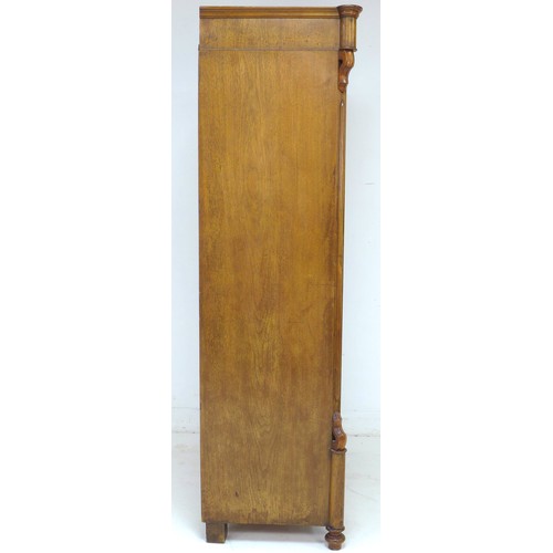 289 - A 19th century mahogany veneered wardrobe, single arched door enclosing a hanging space, raised on t... 