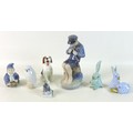 A group of seven ceramic figurines, comprising a Herend figurine, modelled as two rabbits, painted b... 