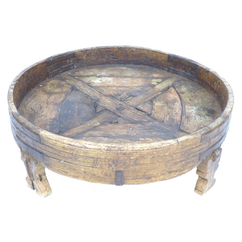 262 - A 19th century wooden barrel stand, of circular form, the shallow bowl with decorative bands to the ... 