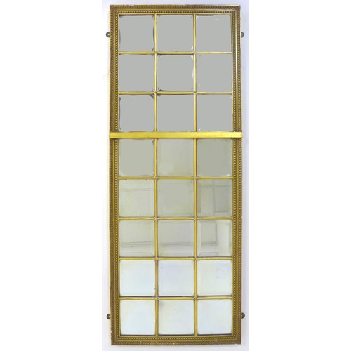 292 - An Edwardian sectional wall mirror, the gilt frame inset with twenty-eight bevelled square mirror pl... 