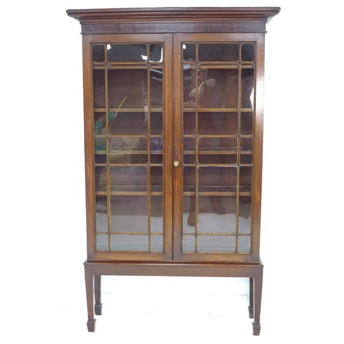 283 - An Edwardian mahogany display cabinet, twin astragal glazed doors enclosing four adjustable shelves,... 