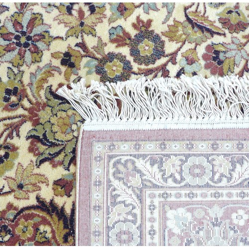 302 - An Ispahan style carpet with cream ground, foliate and floral field with central medallion, red and ... 