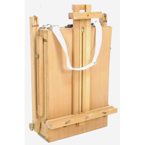 248 - A modern wooden artist's travelling easel, with fold-away legs, and white cotton carry strap, 40.5 b... 