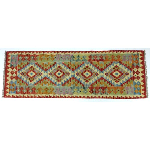 277 - A vegetable dyed wool Choli Kilim runner, with pale green ground and orange edges, four diamond meda... 