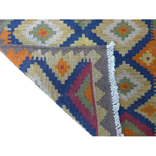 240 - A Maimana Kilim rug with dark blue ground, multi coloured diamond patterned field, white and grey sa... 