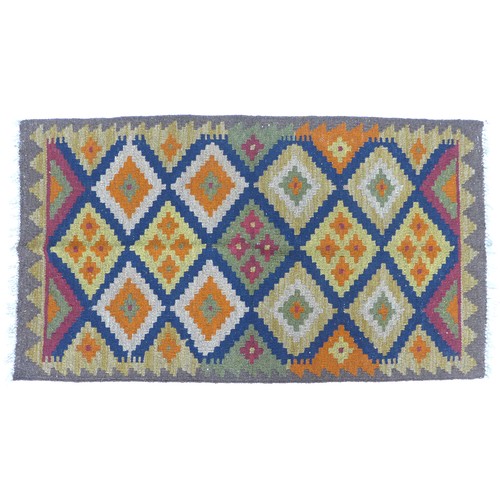 240 - A Maimana Kilim rug with dark blue ground, multi coloured diamond patterned field, white and grey sa... 