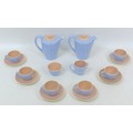 A 1950s Poole Pottery twin tone peach bloom and mist blue coffee set, pattern no. 'C100', comprising... 