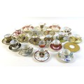 A group of seventeen coffee cups and saucers, together with an Elizabeth II commemorative trio, a sa... 