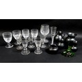 A group of drinking glasses, including an air twist stem glass, and cut glasses, together with a gro... 