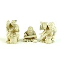A group of three Japanese ivory katabori netsuke, Meiji period, comprising a pair of vendors, one wi... 