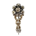 An early 19th century yellow metal and diamond flowerhead brooch, central 4mm rose cut stone surroun... 