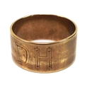 An 18ct gold band, engraved with a calla lily and 'D.H', size R, 6.1g.