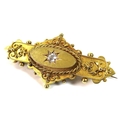 A 19th century 15ct gold gypsy set diamond brooch with safety chain, the single diamond approximatel... 