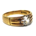 An 18ct gold and diamond solitaire ring, the central old cut diamond of approximately 0.85ct, measur... 