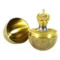 A Stuart Devlin silver gilt 'Surprise' egg, the outer textured surface opening to reveal a crown, en... 