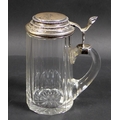 A late 19th century Continental silver mounted cut glass tankard, the stepped circular hinged lid wi... 