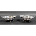 A pair of early 20th century Canadian silver bon bon dishes, of quatrefoil form, each bowl with pier... 