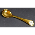 A Georg Jensen gilt Sterling silver 1971 year spoon, with enamel cherry blossom to its finial, Desig... 