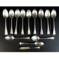 A group of thirteen pieces of George III and later silver flatware, comprising twelve old English pa... 