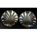 A pair of Edward VII silver dishes, of shell form raised on three ball feet, Atkin Brothers, Sheffie... 