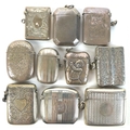 A group of Edwardian silver vesta cases, including one with embossed decoration of a lady golfer in ... 