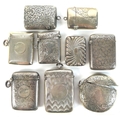 A group of Edwardian silver vesta cases, including a round example with engraved swirling decoration... 