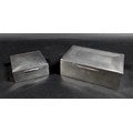 Two George V silver cigarette boxes, comprising a rectangular form box with 'Angus' inscribed to its... 