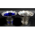 A pair of Edwardian silver baskets, of decagon form with shaped scroll rims and pierced decoration t... 