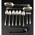 A suite of similar George III silver spoons, all Old English pattern with bright cut decoration, com... 