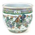 A modern Chinese famille verte fish bowl, decorated externally with various figures in a continuous ... 