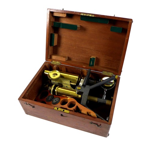 126 - A late Victorian brass compound microscope, J. Swift & Son, London, in fitted mahogany case, with va... 