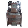 A late 19th century Canadian Clarabella harmonium, with mahogany case, a square form stained glass m... 