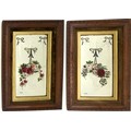 A pair of vintage painted mirrors, each painted with a basket of roses and forget-me-nots, hanging f... 