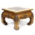 A modern Indonesian hardwood side table, square surface, cared floral decoration, short curved legs,... 
