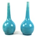 A pair of Burmantofts faience pottery bottle vases, late 19th century, decorated with a turquoise gl... 