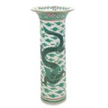 A modern Chinese porcelain famille verte sleeve vase, with flared rim, decorated with two front faci... 