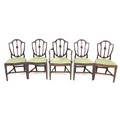 A set of five reproduction Georgian style mahogany dining chairs, with shield shaped carved and moul... 